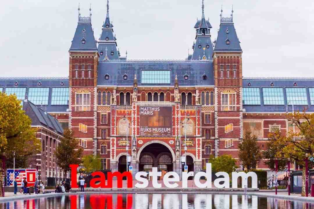 Night view of Amsterdam cityscape – discreet and elegant escort services available 24/7