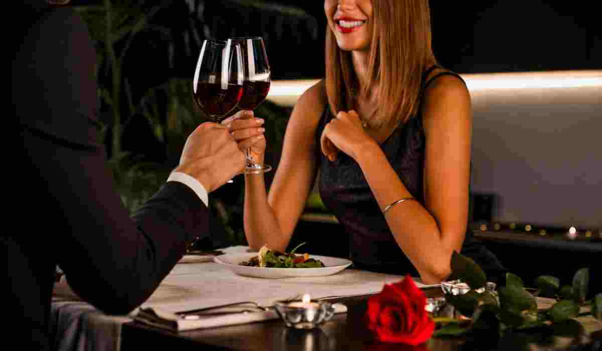 Sophisticated escort woman dining with a client in a luxury Amsterdam restaurant