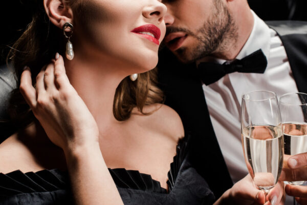 Elegant couple enjoying an escort date in Amsterdam with canal view